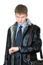 Young man looking at his wristwatch Royalty Free Stock Photo