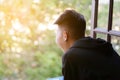 Young man looking out of window Royalty Free Stock Photo