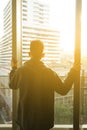 Young man looking out of window Royalty Free Stock Photo