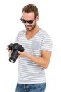 Young man looking at picture on digital camera Royalty Free Stock Photo