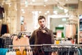 A young man looking for a present for his girlfriend in a department store Royalty Free Stock Photo