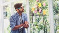 Young man looking at sticky note message and write the text in the book Royalty Free Stock Photo