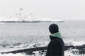 Young man looking to the horizon in a cold winter day Royalty Free Stock Photo