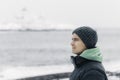 Young man looking to the horizon in a cold winter day Royalty Free Stock Photo