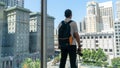 Young man looking at Union Square view from top floor of Macys store in Union Square, San Francisco, USA Royalty Free Stock Photo