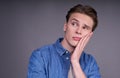 The young man looks away with a pensive, sad, calm expression Royalty Free Stock Photo