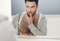 Man looks at himself in the mirror Royalty Free Stock Photo