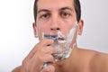 Young man with lots of shaving cream on his face prepar Royalty Free Stock Photo