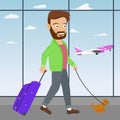 Young man with luggage and dog waiting airplane in the airport waiting room Royalty Free Stock Photo