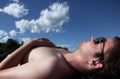 Young man lying on a beach, Royalty Free Stock Photo