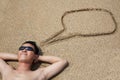 Young man lying on the beach Royalty Free Stock Photo