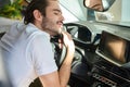 Tired male driver sleeping in his car Royalty Free Stock Photo