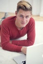 Young man lying on floor with laptop Royalty Free Stock Photo