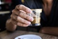 Young man with a macchiato in a coffeehouse