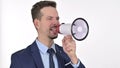 Young Man making Announcement on Loudspeaker , White Background Royalty Free Stock Photo