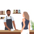 Young man making coffee for customer. Man standing behind counter and offering hot drink