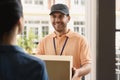 Young man making home delivery Royalty Free Stock Photo