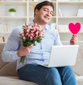 The young man making marriage proposal over internet laptop Royalty Free Stock Photo