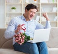 Young man making marriage proposal over internet laptop Royalty Free Stock Photo