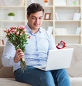 Young man making marriage proposal over internet laptop Royalty Free Stock Photo