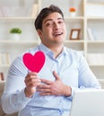 Young man making marriage proposal over internet laptop Royalty Free Stock Photo