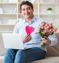 Young man making marriage proposal over internet laptop Royalty Free Stock Photo