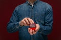 Young man making wedding proposal holding box with engagement ring. Royalty Free Stock Photo