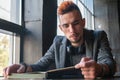 Young man male student hipster reading a book. Knowledge, education, development concept. Horizontal image Royalty Free Stock Photo