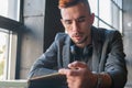 Young man male student hipster reading a book. Knowledge, education, development concept Royalty Free Stock Photo