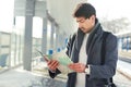 Young man with map at train station Royalty Free Stock Photo