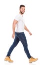 Young man marching in jeans and white t-shirt Royalty Free Stock Photo