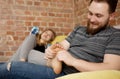 Young man massaging his lover`s feet. Royalty Free Stock Photo