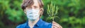 Young man in a medical mask because of an allergy to ragweed BANNER, long format Royalty Free Stock Photo