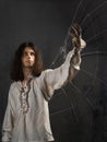 Young man in medieval clothes in the image of Da Vinci, dreams of flight. Royalty Free Stock Photo