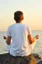 Young man is meditating Royalty Free Stock Photo