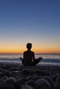 Young man meditating at morning time Royalty Free Stock Photo