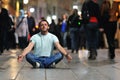 Young man meditating yoga in lotus position Royalty Free Stock Photo