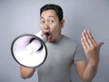 Young Man With Megaphone Advertisement Concept, Smiling Expression Royalty Free Stock Photo