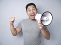 Young Man With Megaphone Advertisement Concept, Smiling Expression