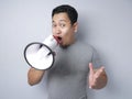 Young Man With Megaphone Advertisement Concept, Smiling Expression