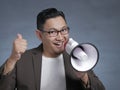Young Man With Megaphone Advertisement Concept, Smiling Expression