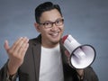 Young Man With Megaphone Advertisement Concept, Smiling Expression