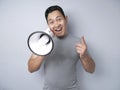 Young Man With Megaphone Advertisement Concept, Smiling Expression