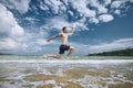 Joyful man jumping on beach Royalty Free Stock Photo