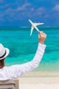 Young man with miniature of an airplane at Royalty Free Stock Photo