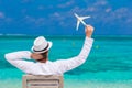 Young man with miniature of an airplane at Royalty Free Stock Photo