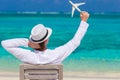 Young man with miniature of an airplane at Royalty Free Stock Photo