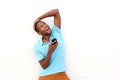 Young man with mobile phone looking away and laughing Royalty Free Stock Photo