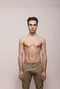 Young man model shirtless body posing pants Royalty Free Stock Photo