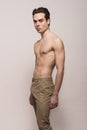 Young man model shirtless body posing pants Royalty Free Stock Photo